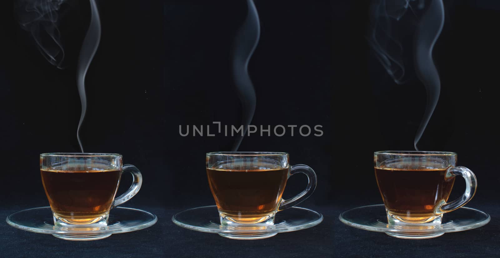Three glass cups of hot tea