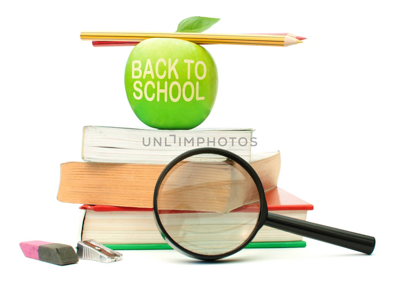 Back to school carved into an apple on a stack of books