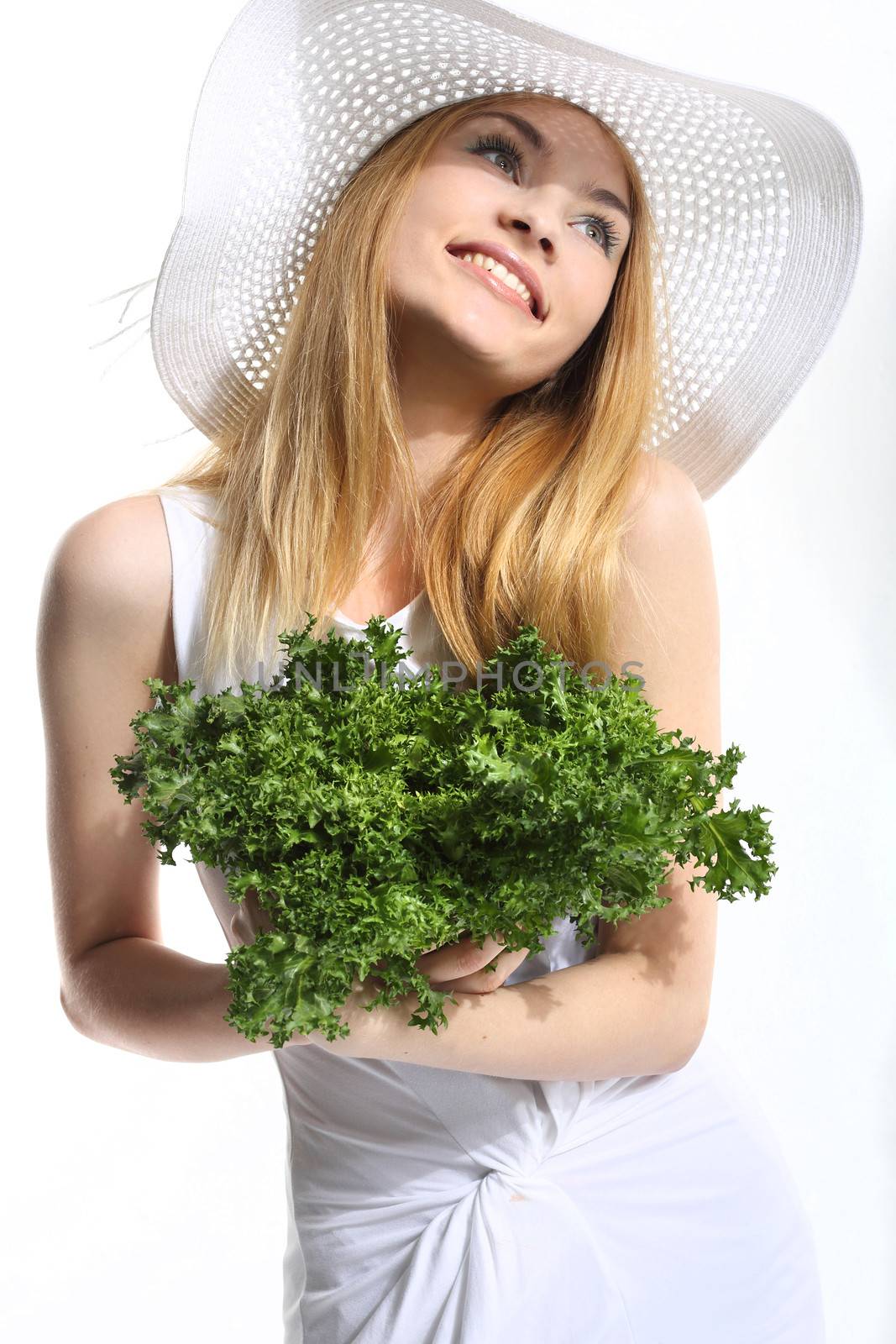 Woman with green salad leaves