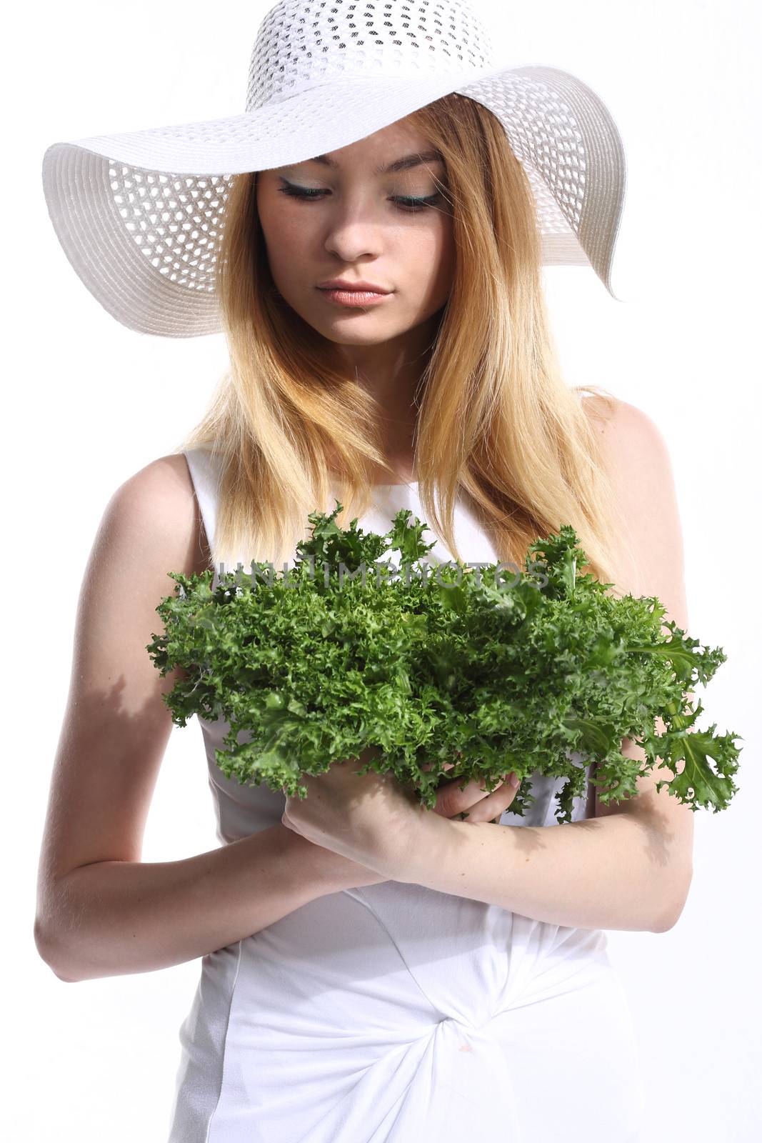 Woman with green salad leaves