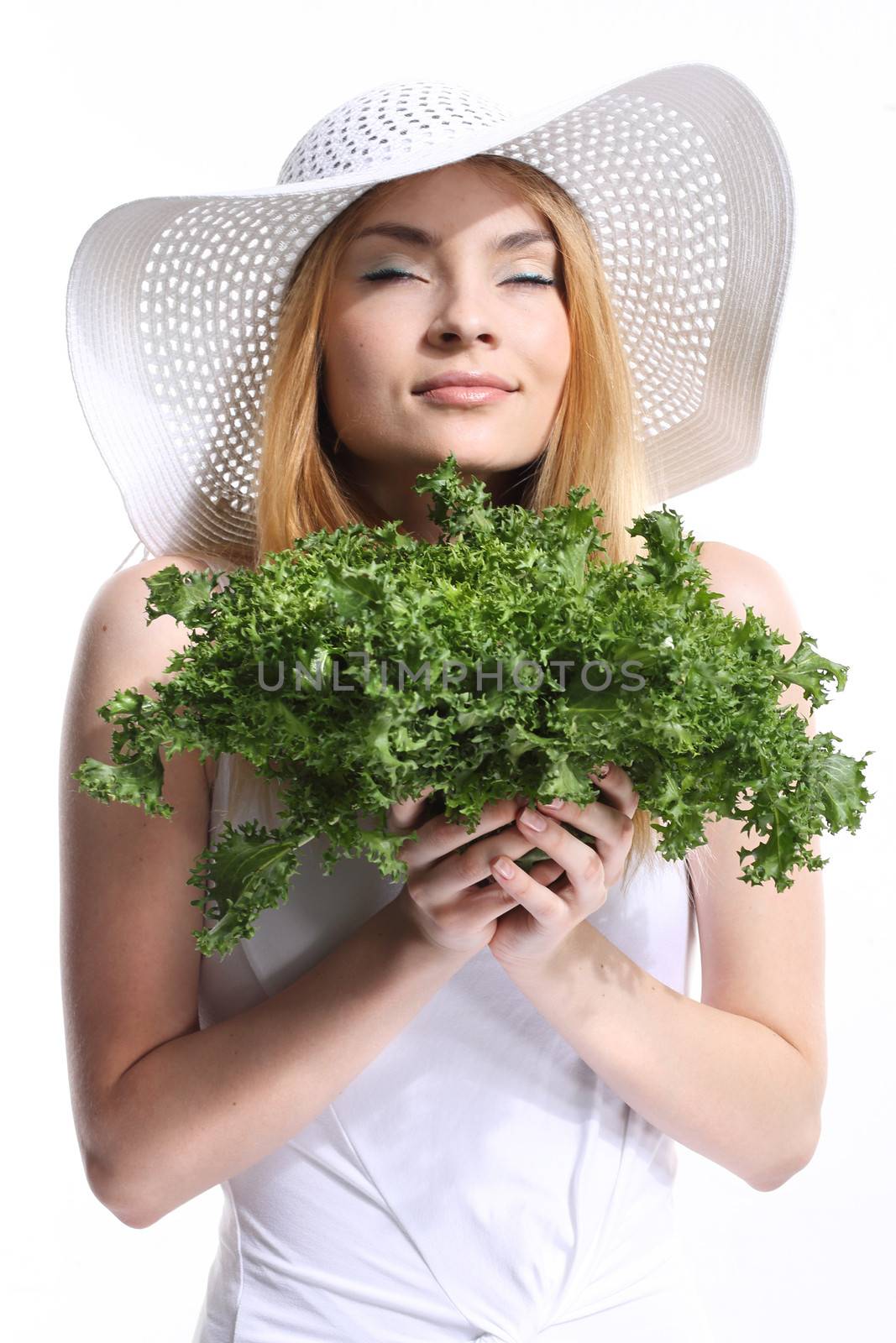 Woman with green salad leaves by robert_przybysz