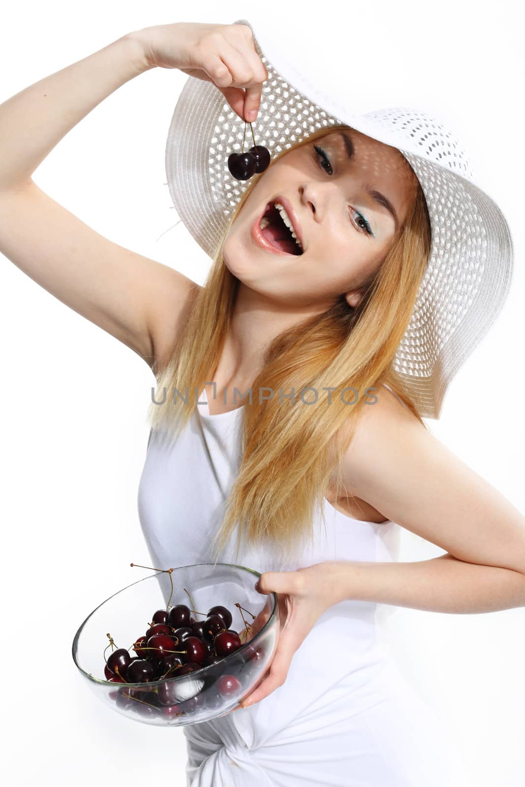 Young pretty woman with cherry on the white background