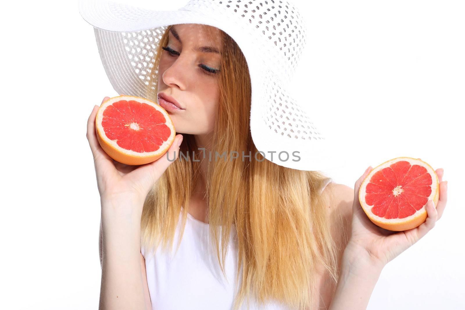 Girl with fresh grapefruit