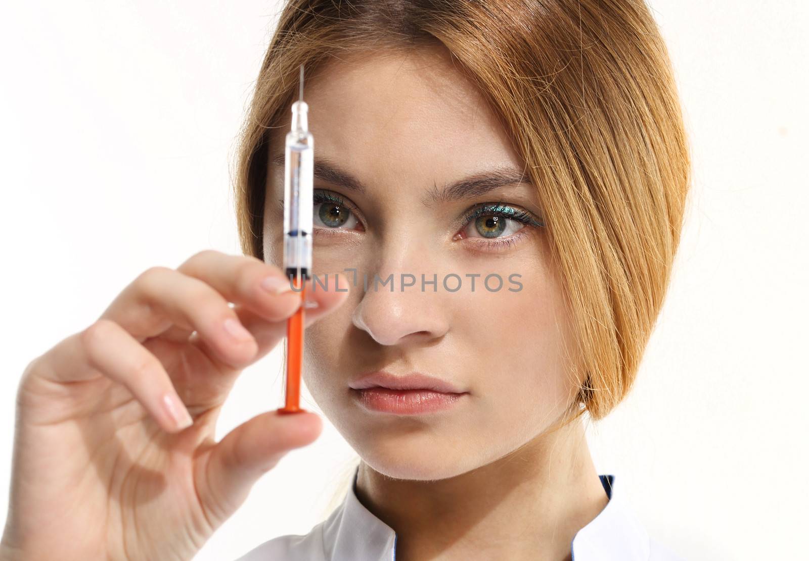 Female doctor with syringe by robert_przybysz
