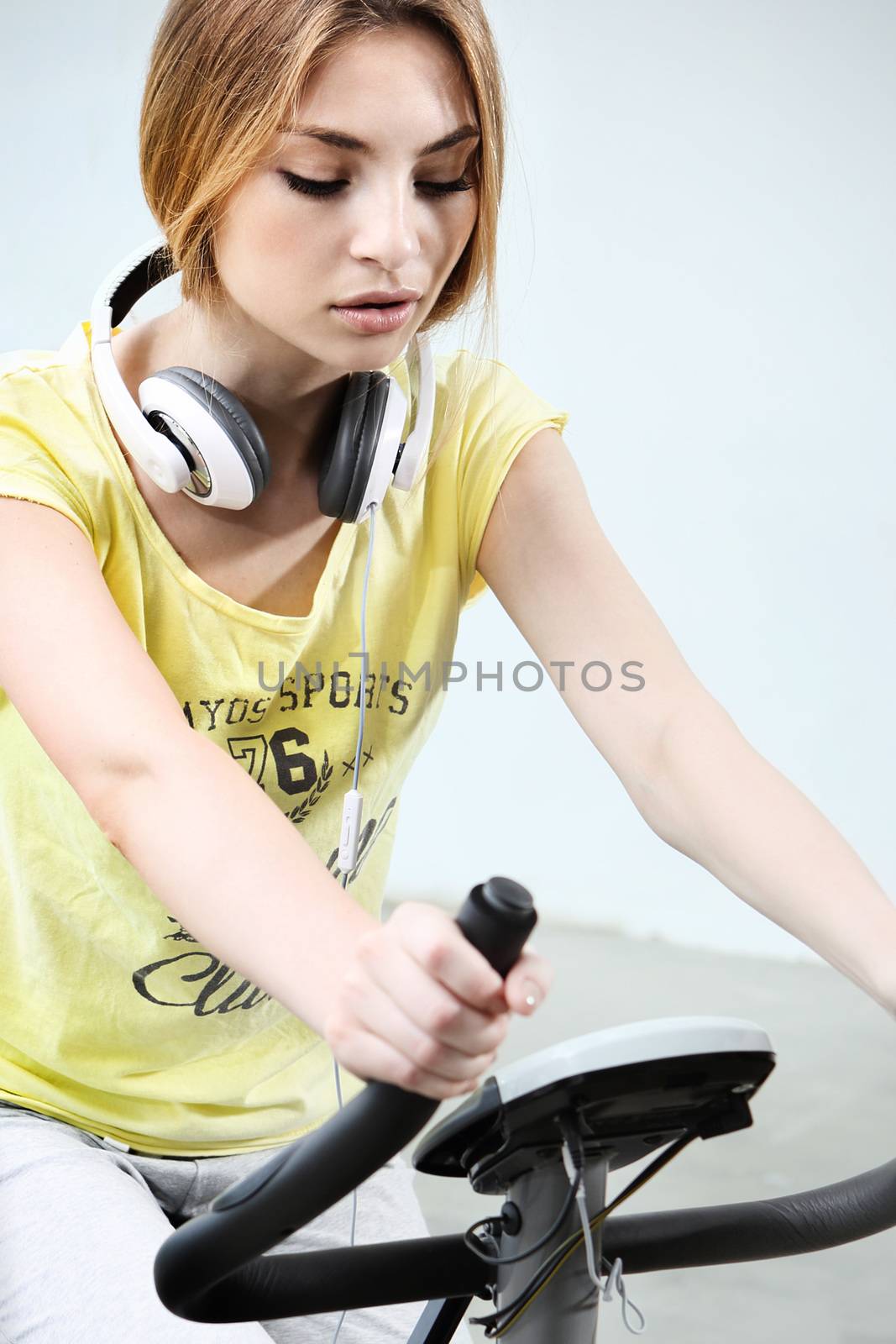 Young girl on stationary bike