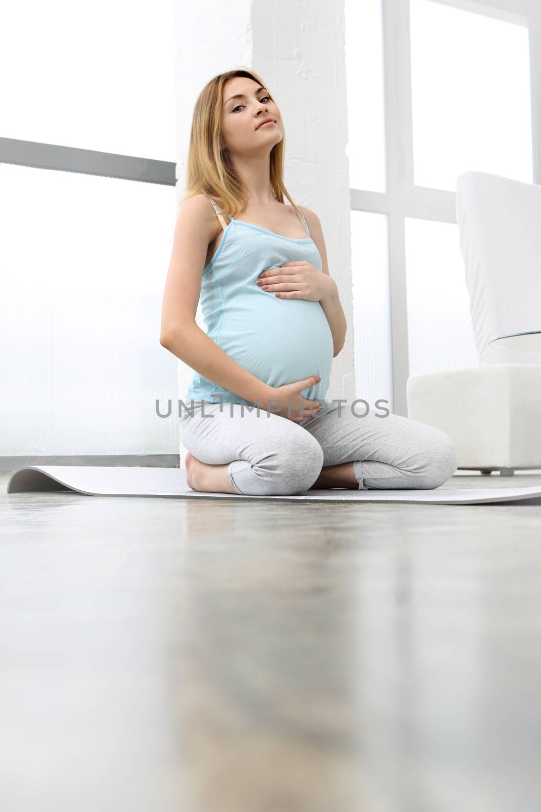 Pregnant woman doing yoga exercise