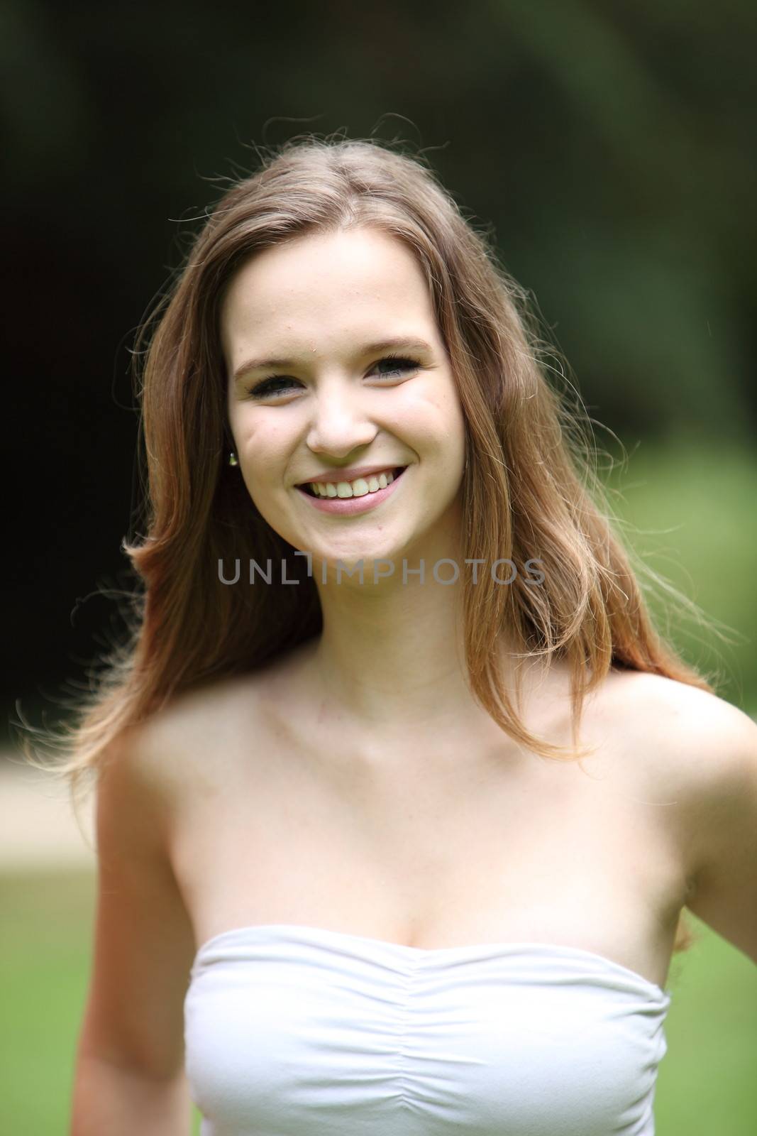 Young smiling woman in a close up portrait