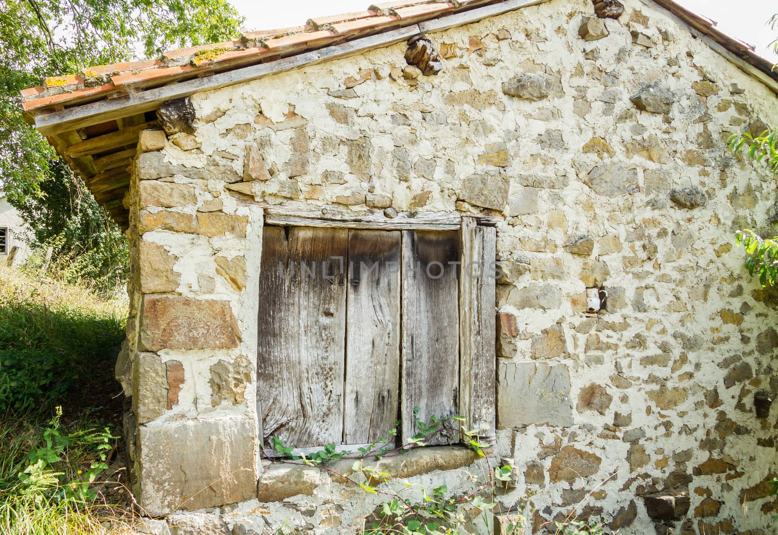 Old wooden gate closed in stone house by doble.d