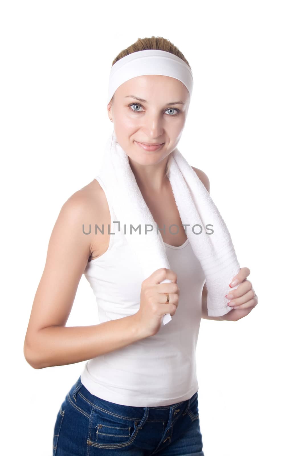 Young sportswoman with natural smile having white towel around neck isolated on white