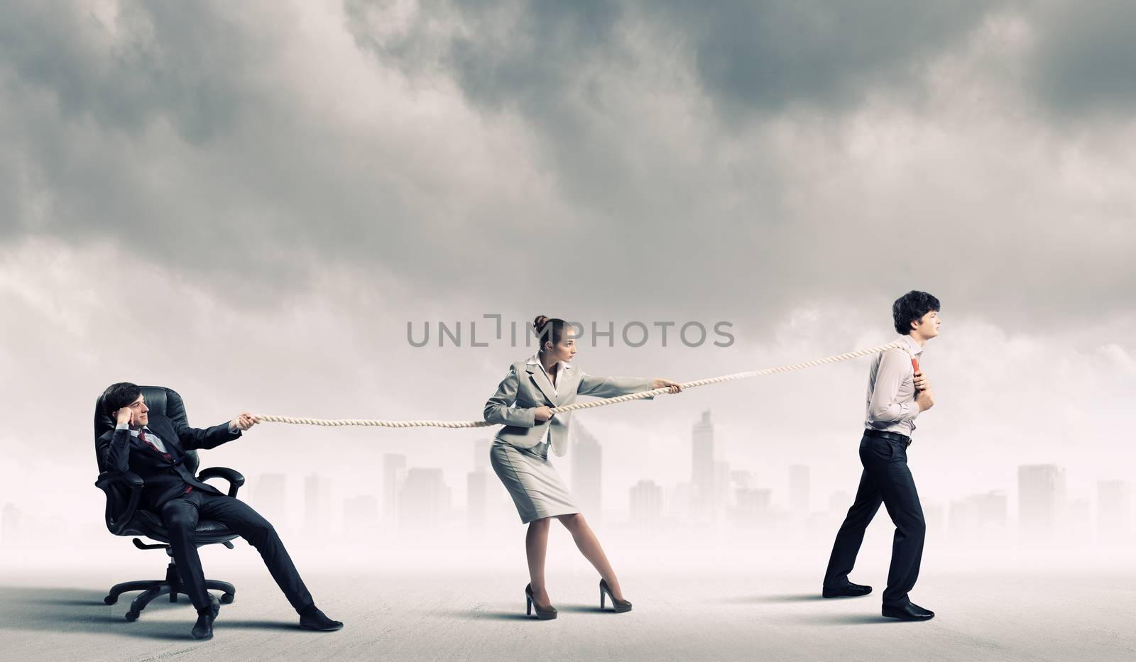 Three business people pulling rope by sergey_nivens