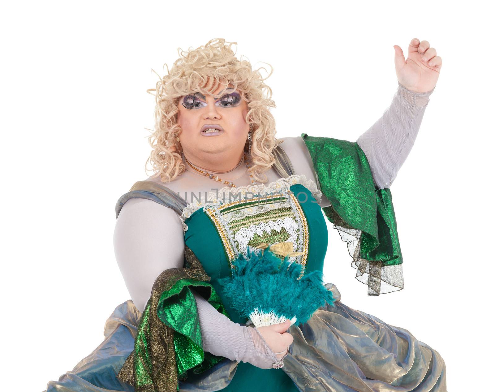 Overweight drag queen in vintage dress and pretty curly blond wig accentuating his weight with Victorian bustles in a fun caricature of a period woman, on white