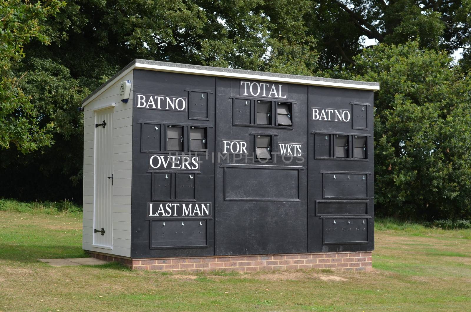 English scoreboard hut at a countryside cricket ground in Bolney village Southern England.