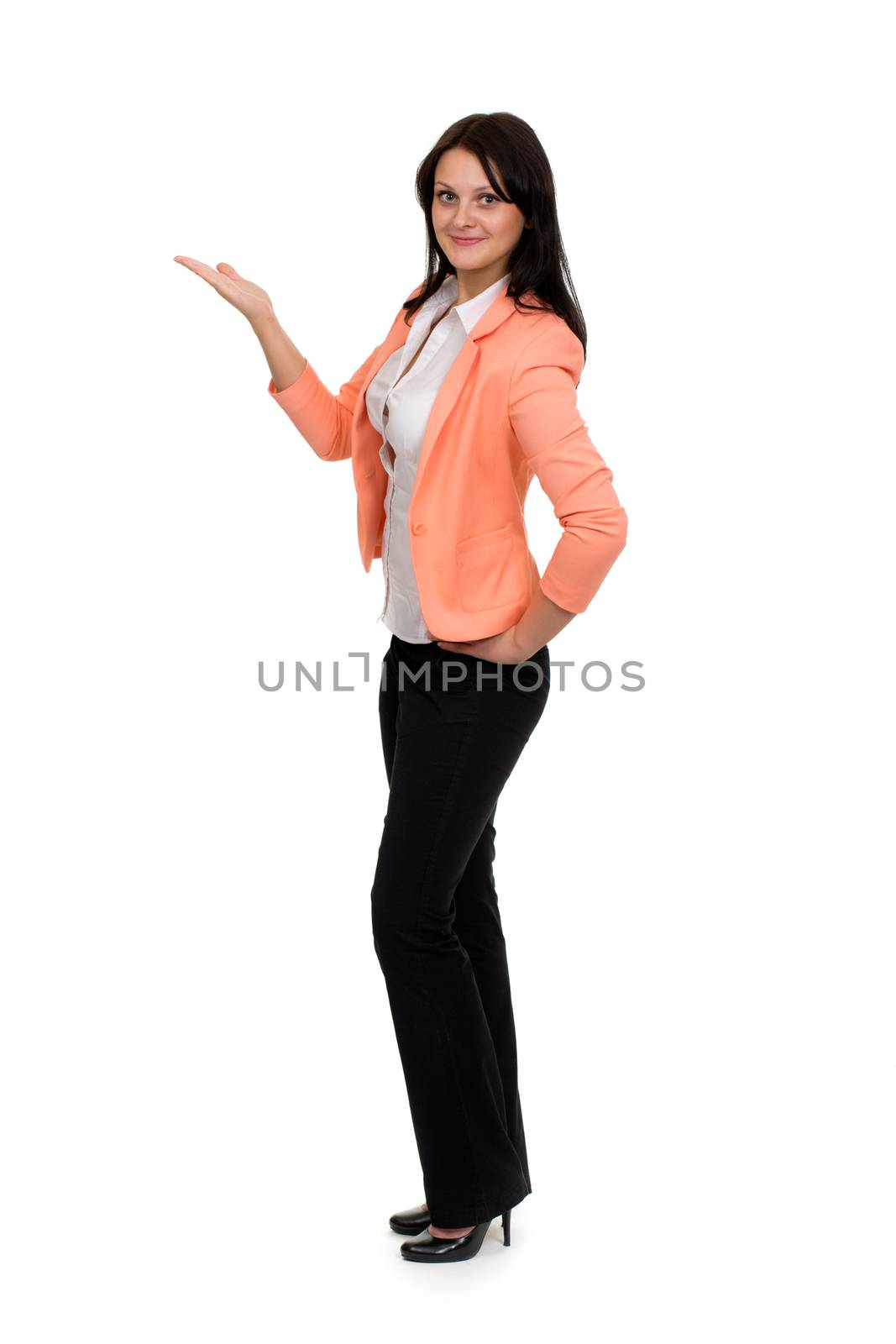 sweet girl in the orange jacket shows his hand on a white background