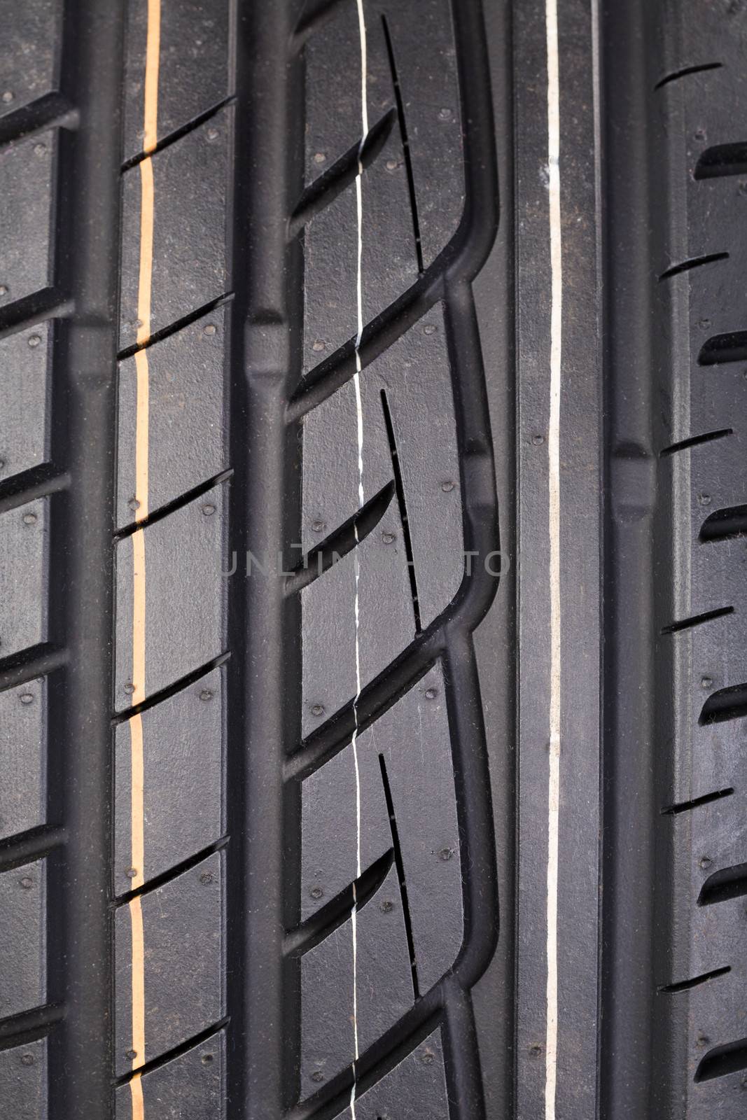 Close-up image or new vehicle tire tread pattern