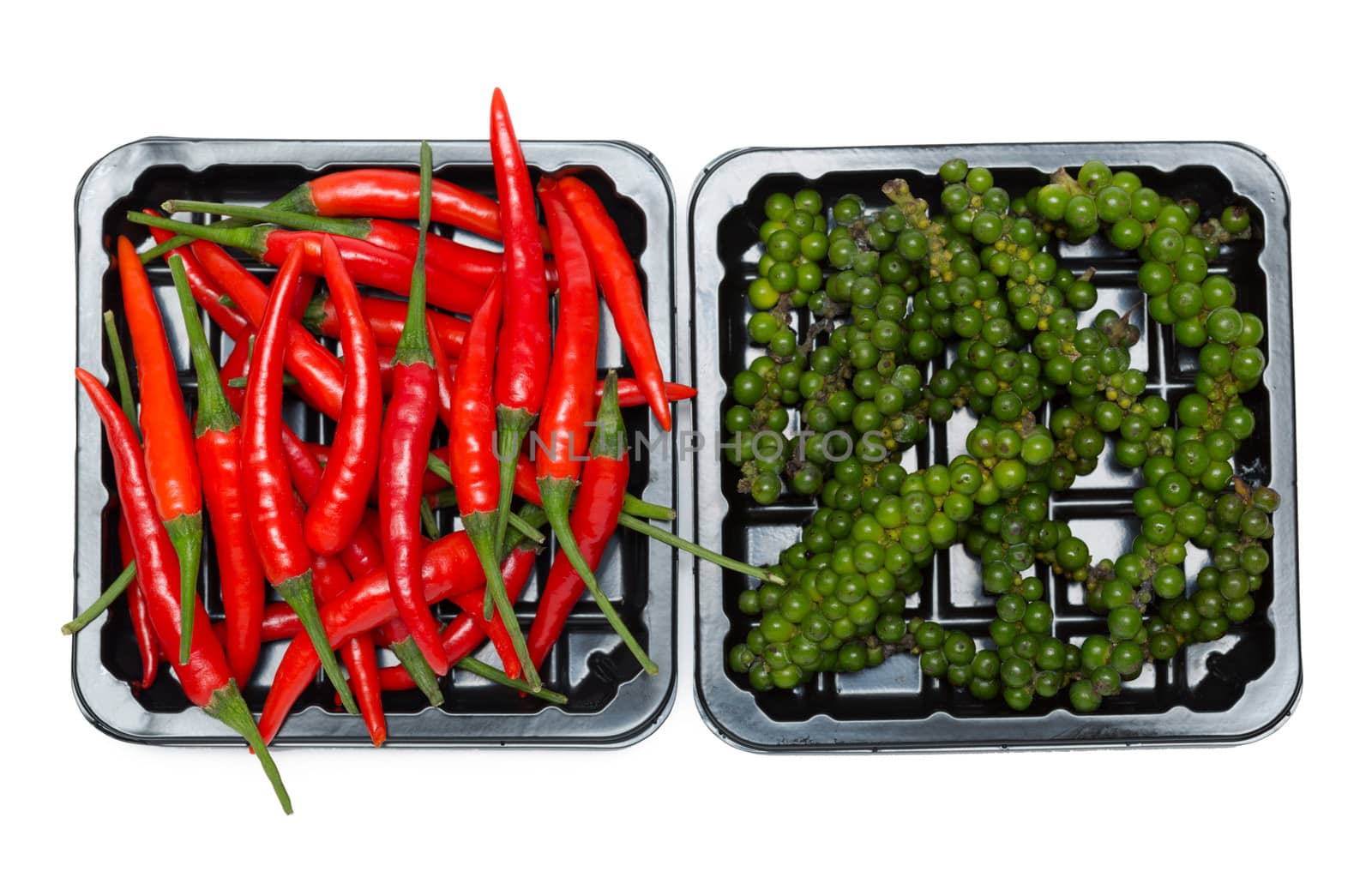 red and black pepper in a plastic box