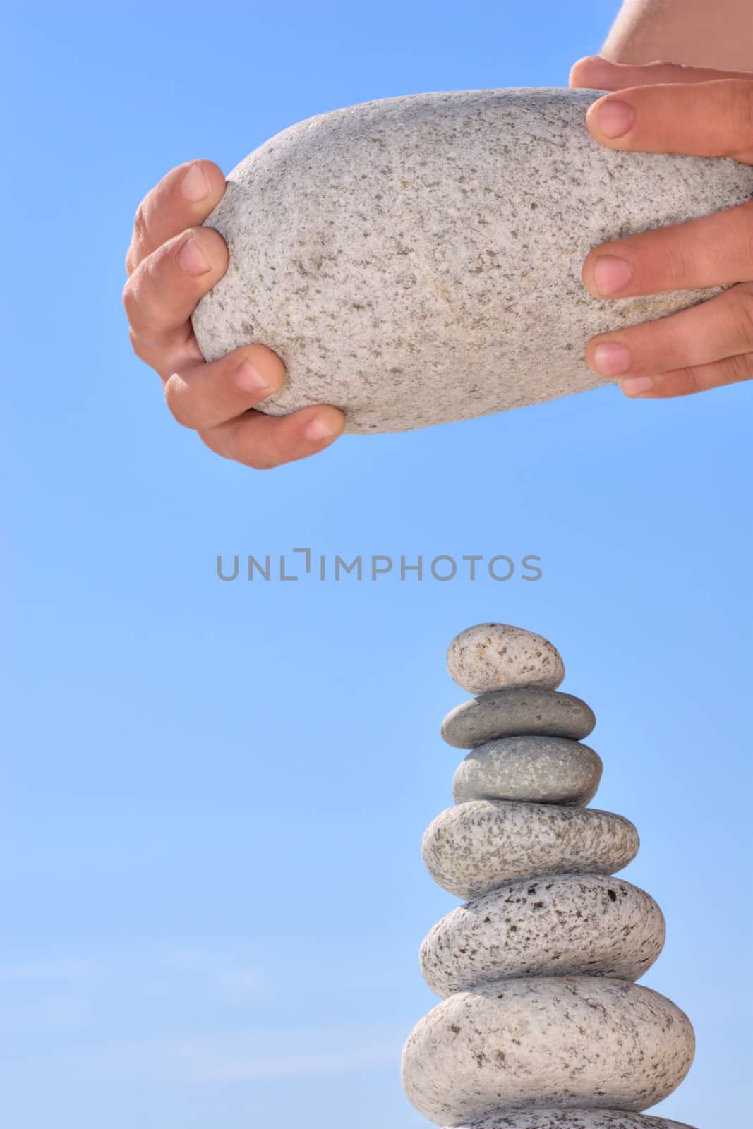 Summer. Wild beach. Someone's hands want to destruct equilibrium. Abstraction of cold war.