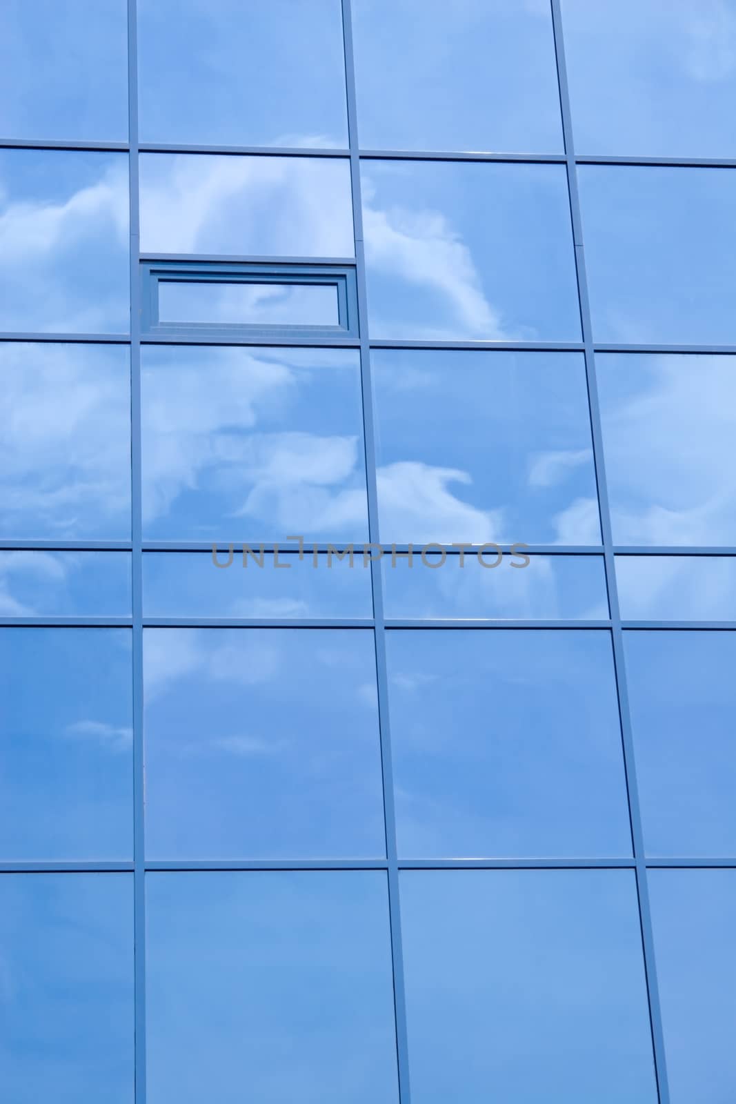 Reflection of the sky in windows of a skyscraper.