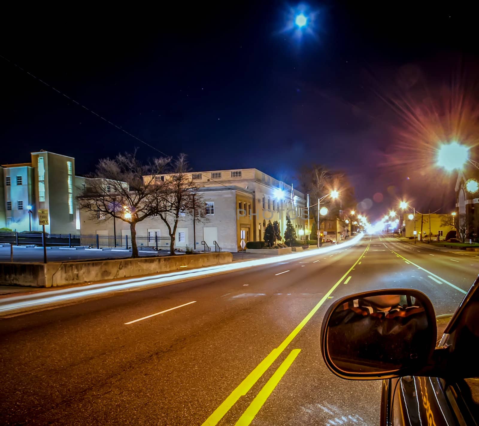 standing in car on side of the road at night in the city by digidreamgrafix