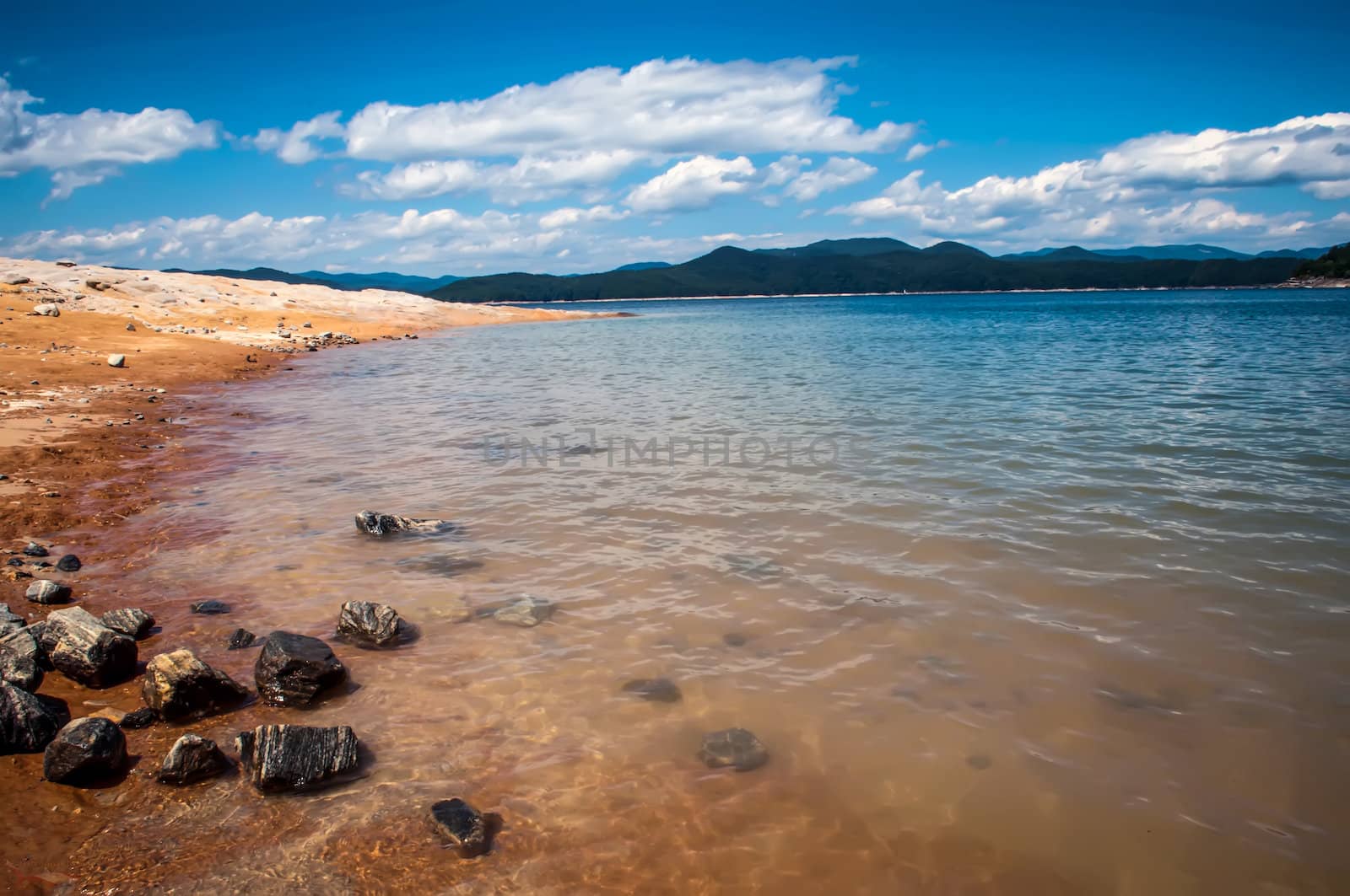 lake jocassee shore on a bright sunny day