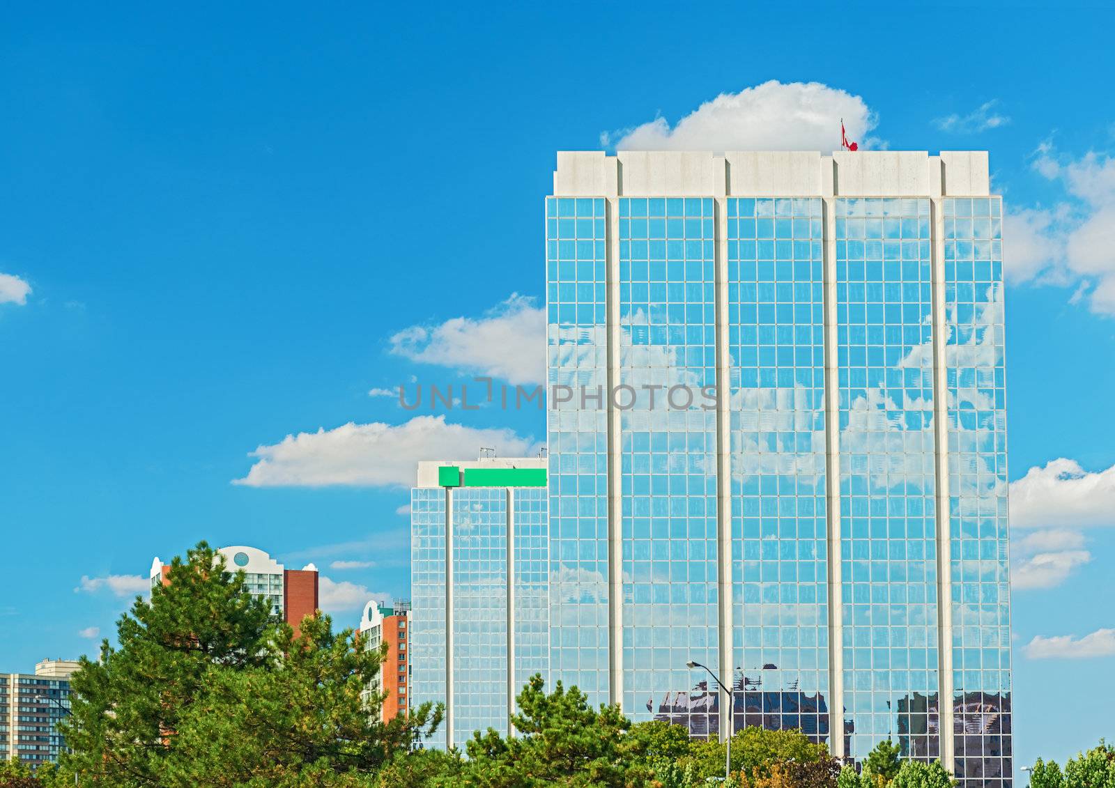 Clouds reflaction on office building windows by Marcus