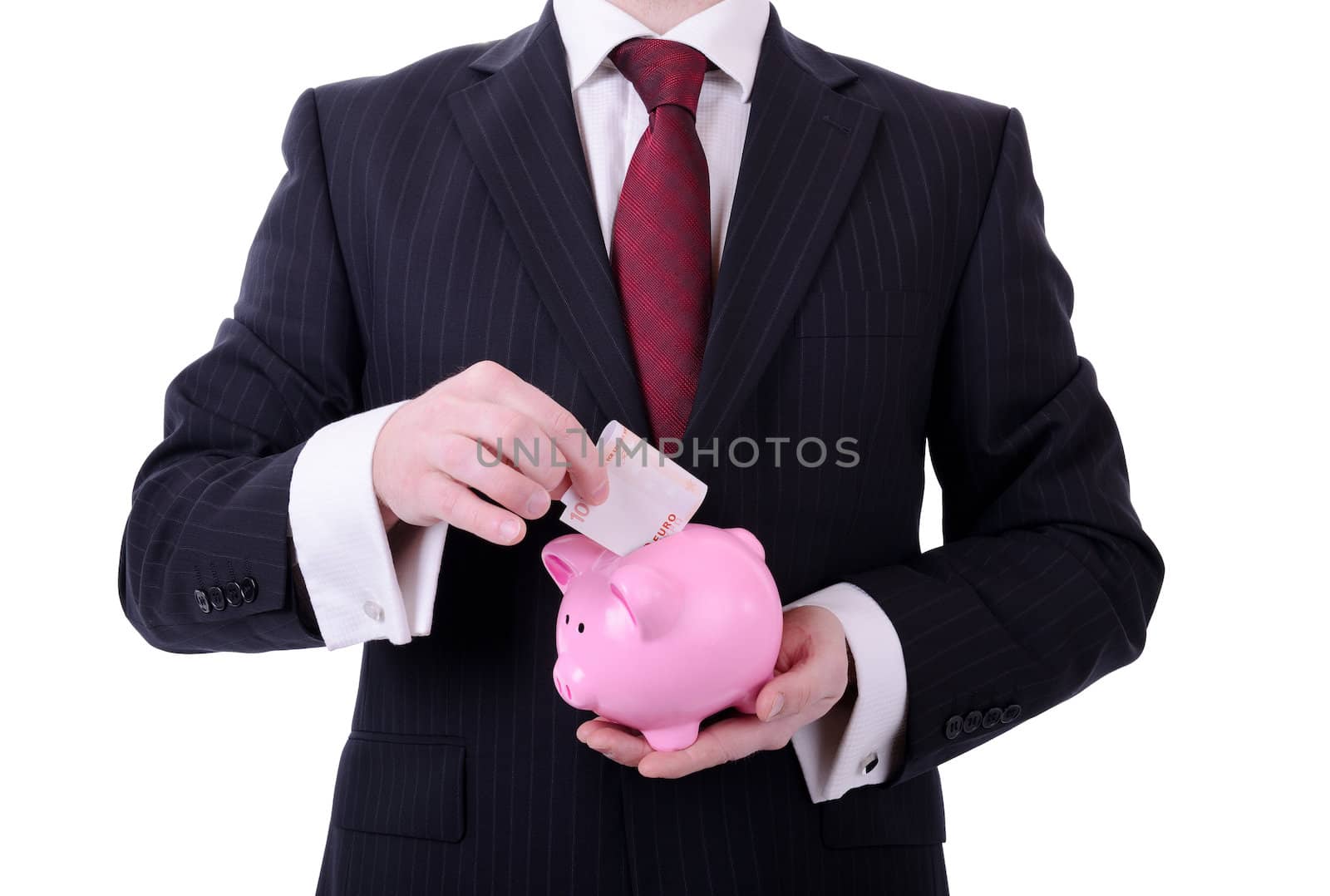 businessman putting a 10 euro note into a piggy bank, concept of saving isolated on white