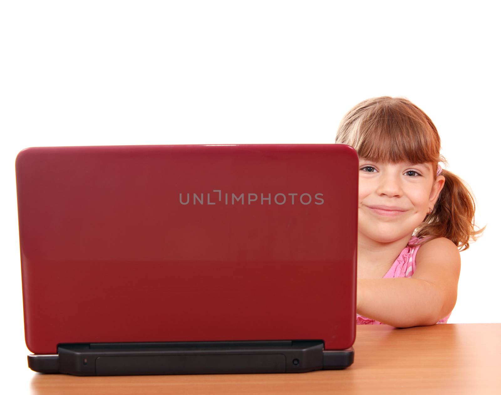 little girl with laptop on white