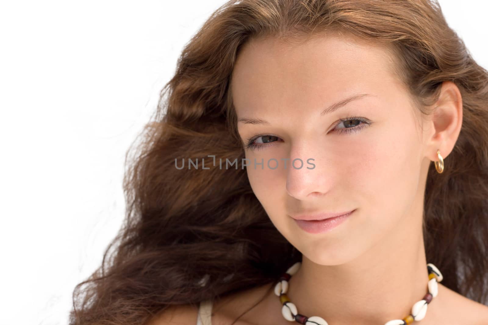 Cheerful girl looking at camera. Isolated on white.
