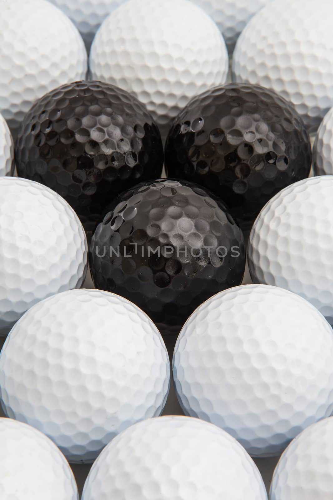 Different black and white golf balls