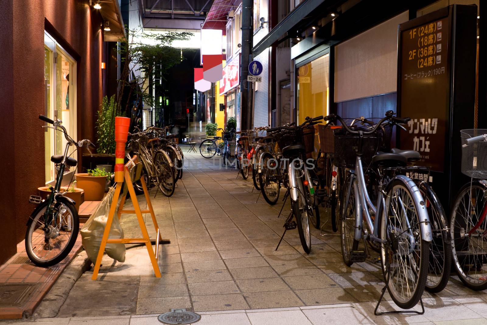 Japan, Kyoto, nightscene. Bicycle parking.