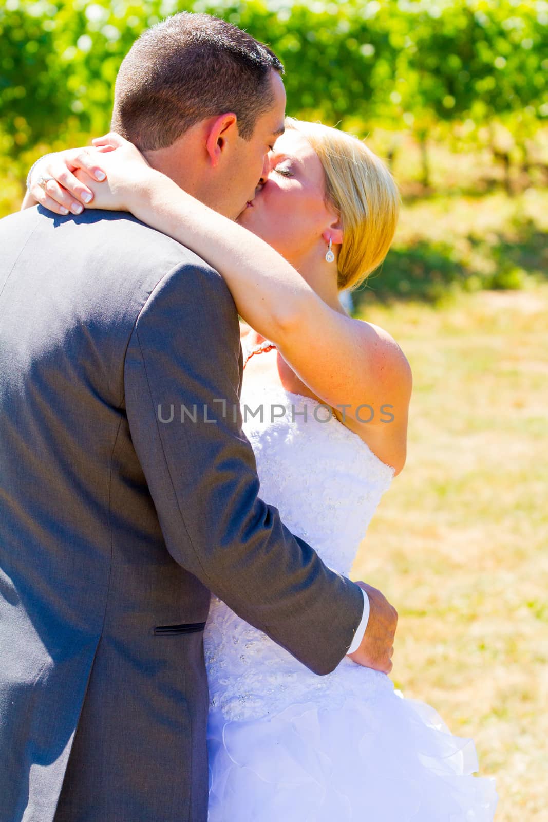 Bride and Groom Romantic Kiss by joshuaraineyphotography