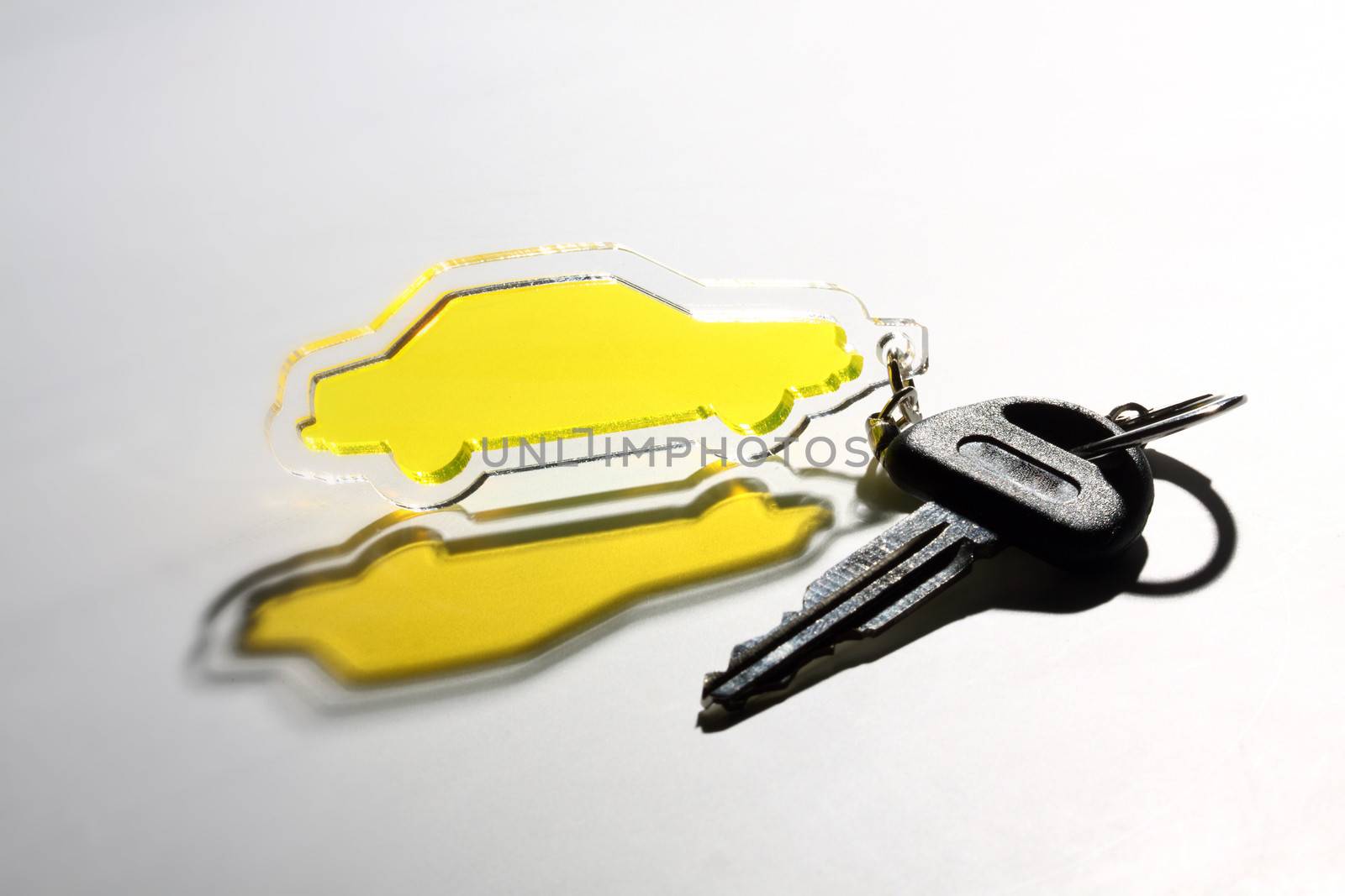 yellow transparent car keychain and key