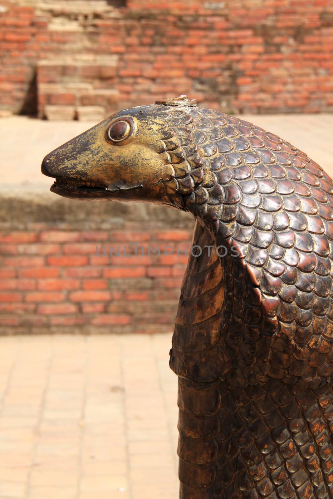 Statue of Bronze cobra in Bhaktapur, Nepal  by nuchylee