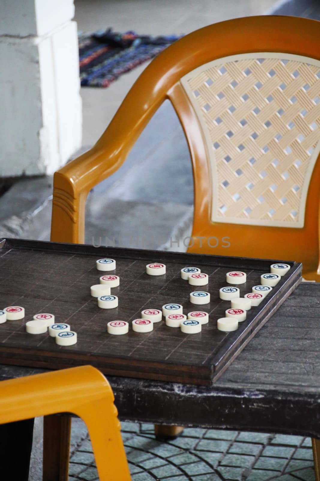 An abandoned game of XiangQi in Hanoi, Vietnam. It is a popular board game played on the streets.