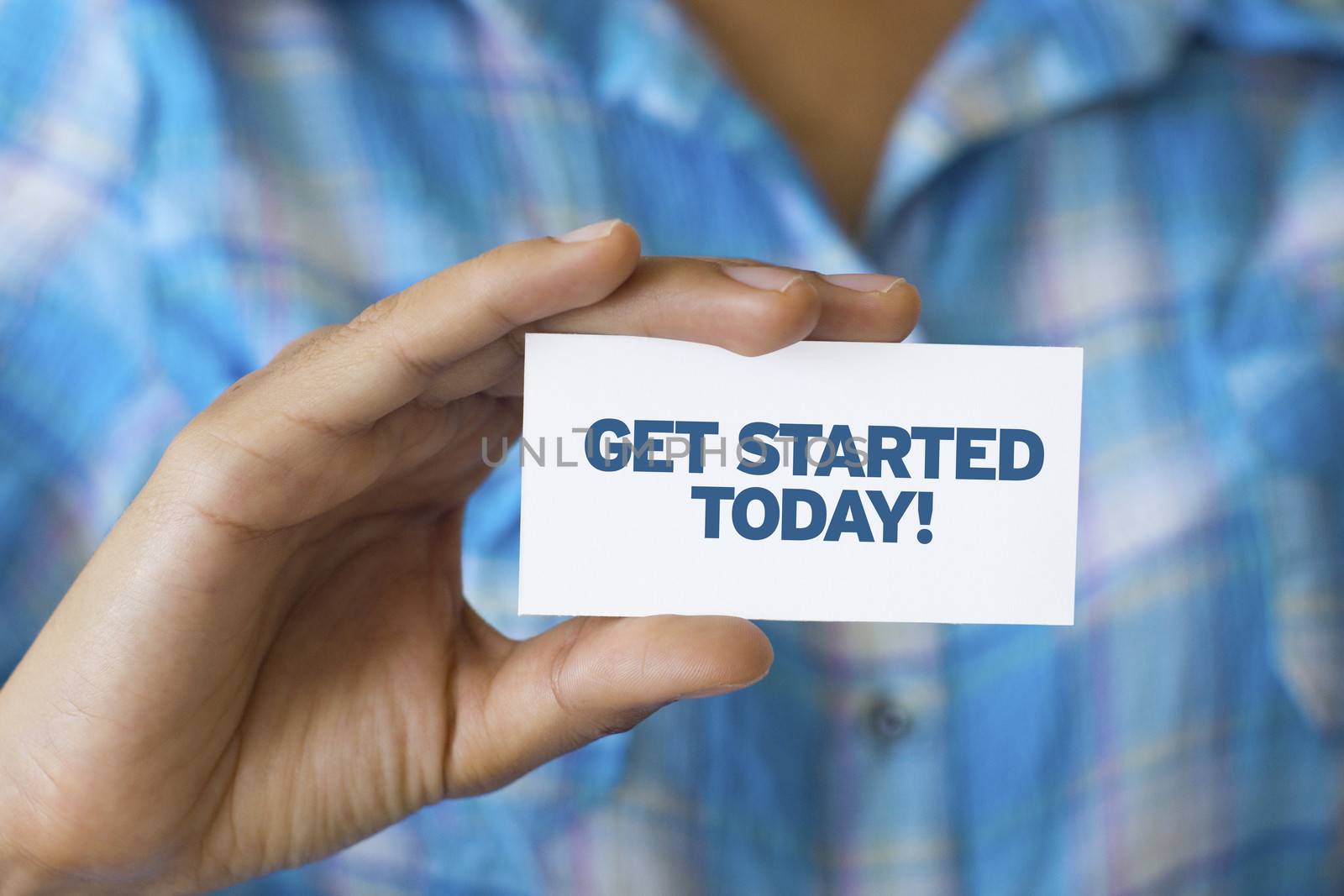 A person holding a white card with the words Get Started Today