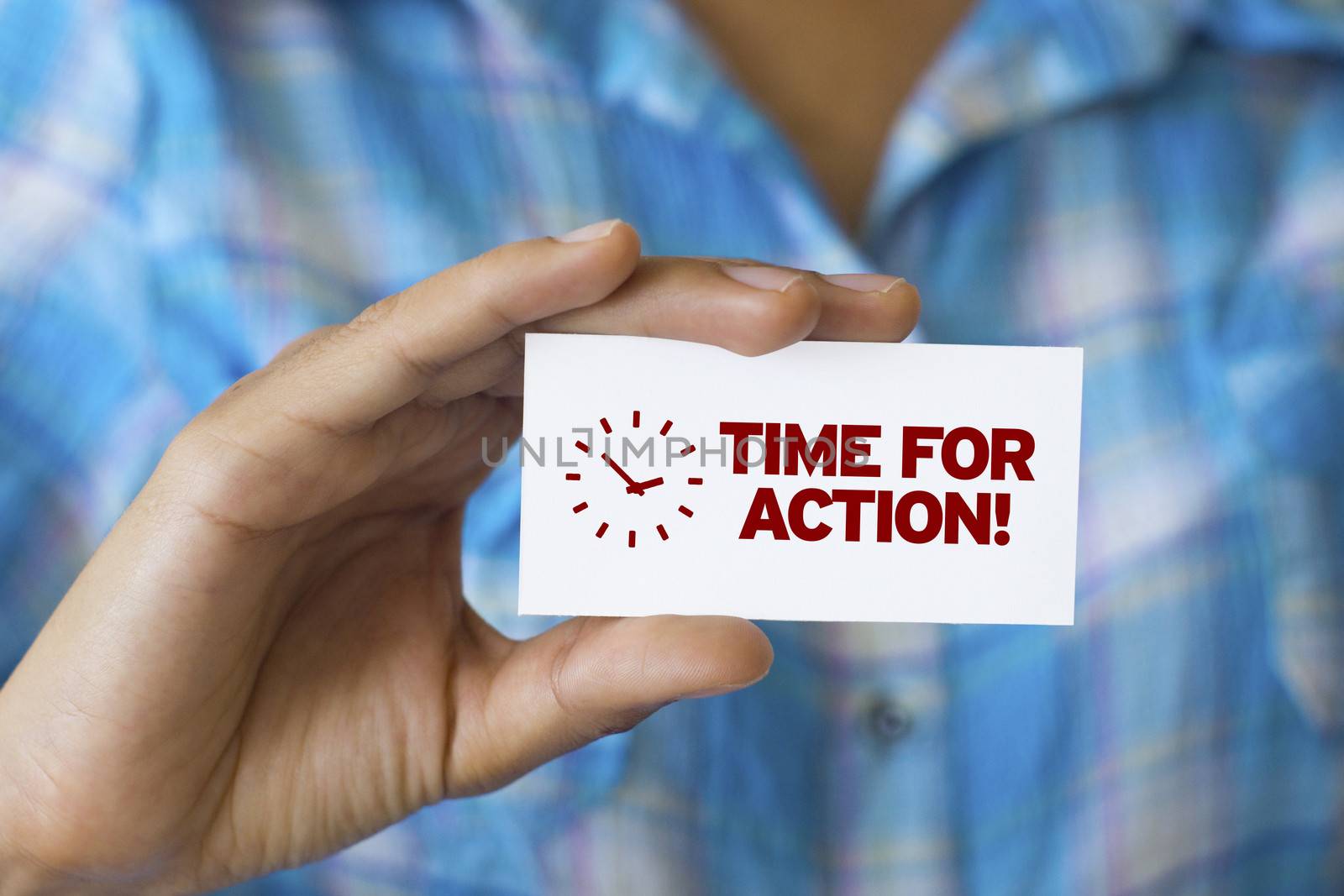 A person holding a white card with the words Time For Action