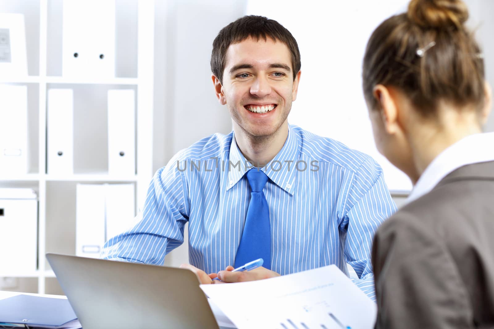 Young businessman in the office by sergey_nivens