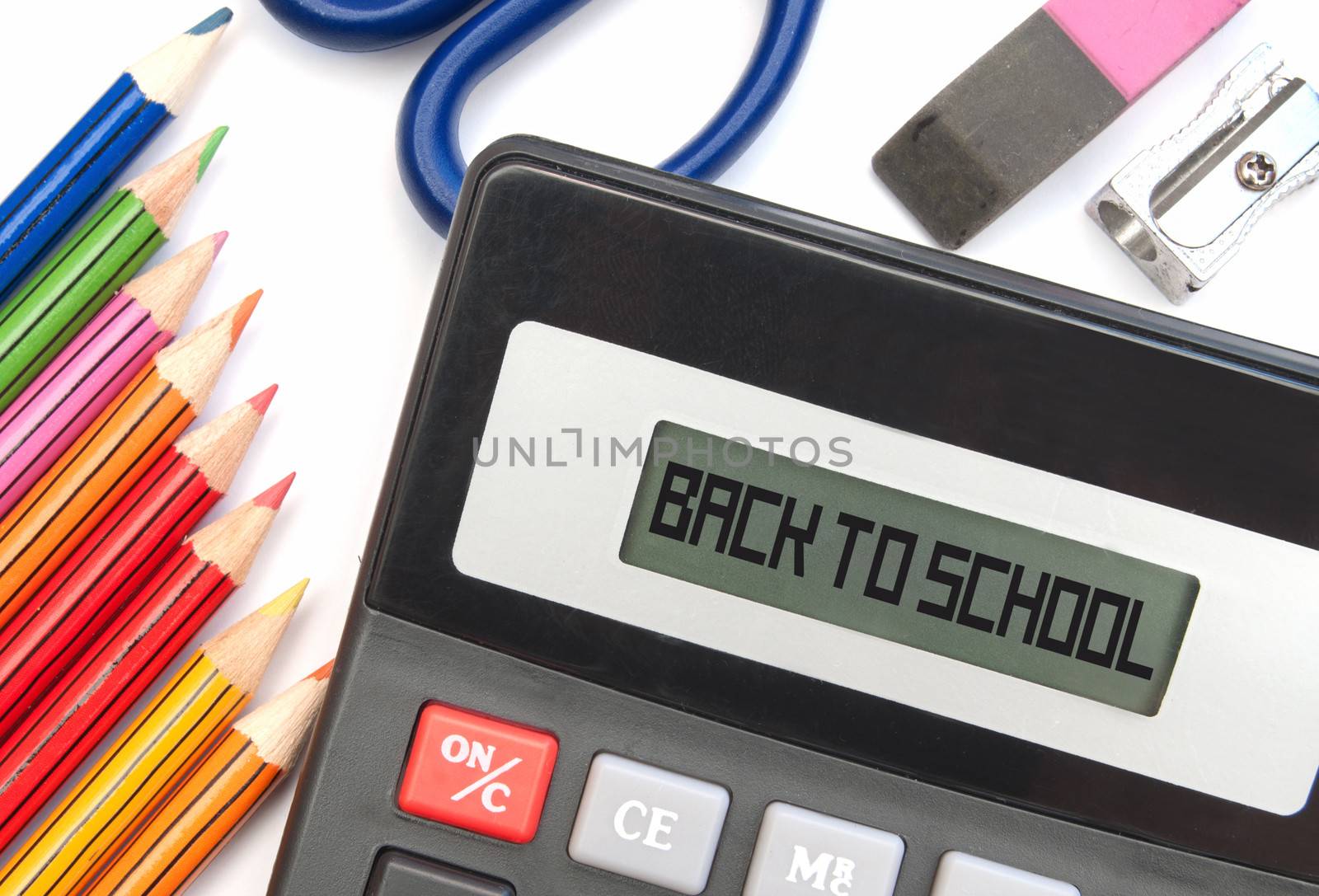 Calculator screen with back to school surrounded with stationery items