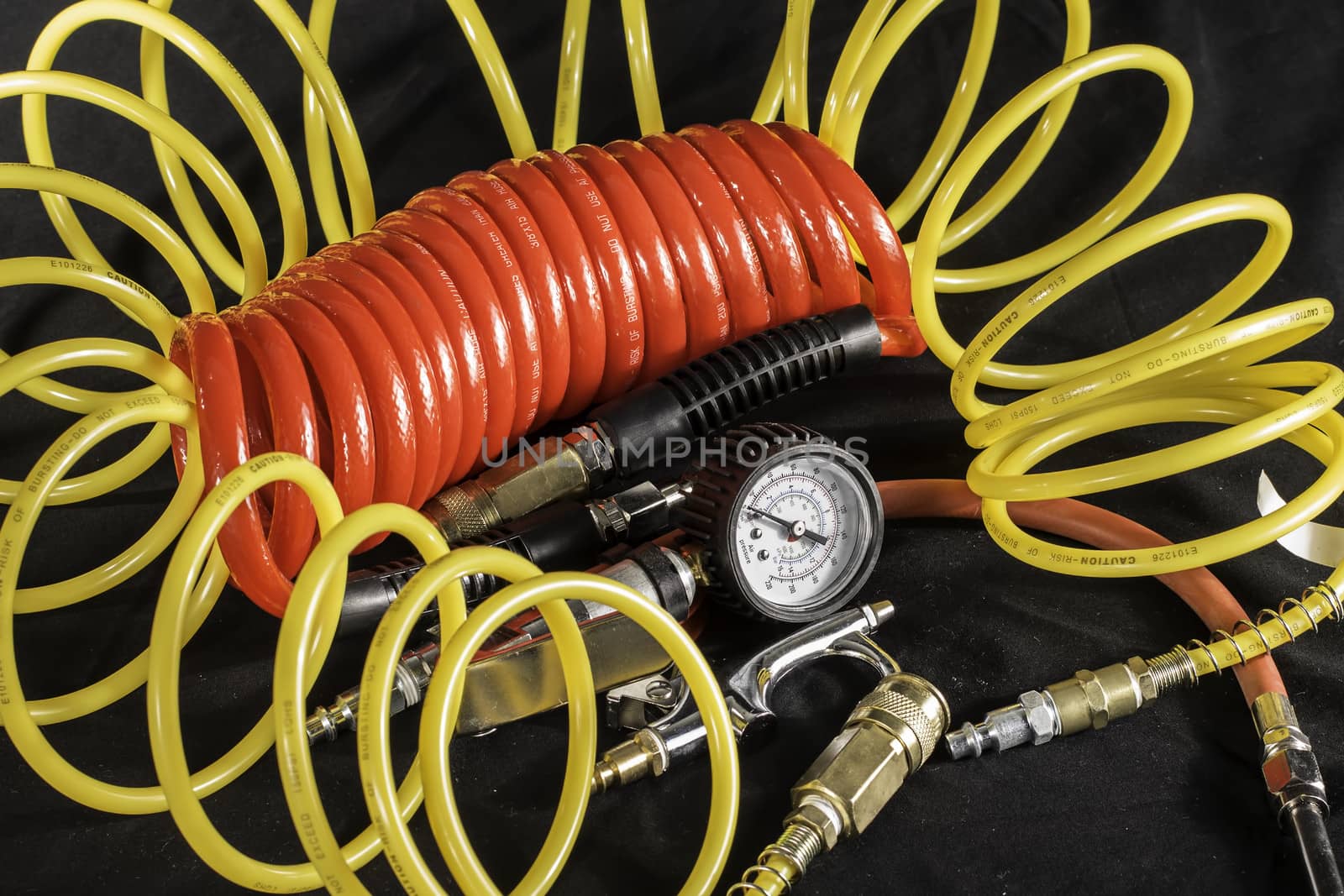 A shot of air hoses and air tools used with an air compressor.