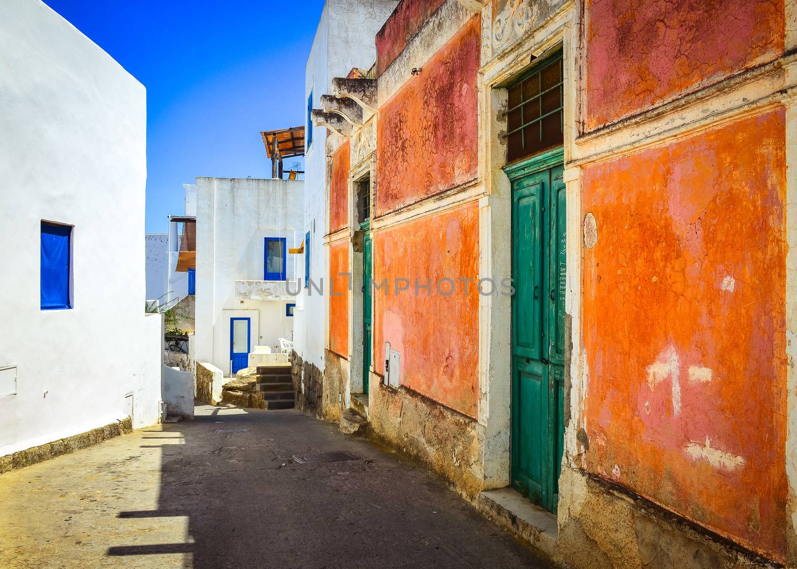 Mediterranean street with colorful walls and doors and windows by martinm303