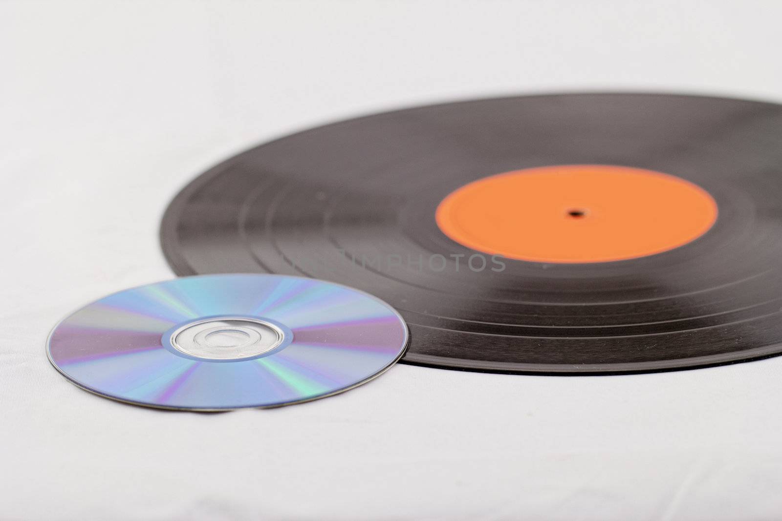 vinyl record  disk and CD (Compact disk) on white background