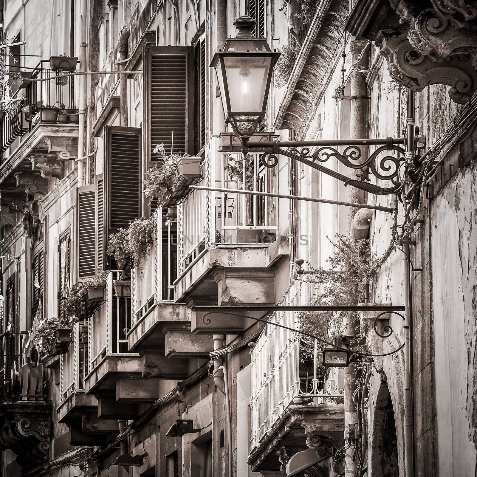 Beautiful vintage balconies and street lamp in old mediterranean by martinm303