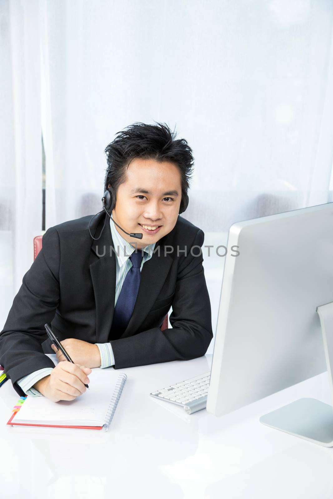 businessman making tele conference with desktop computer