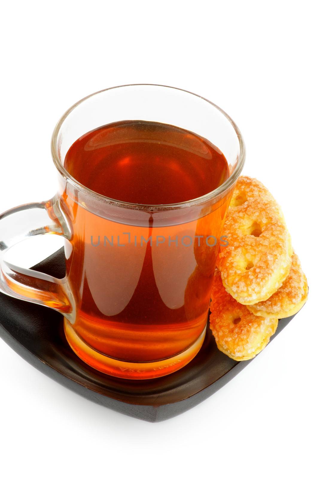 Arrangement of Glass Cup of Tea and Puff Pastry isolated on white background