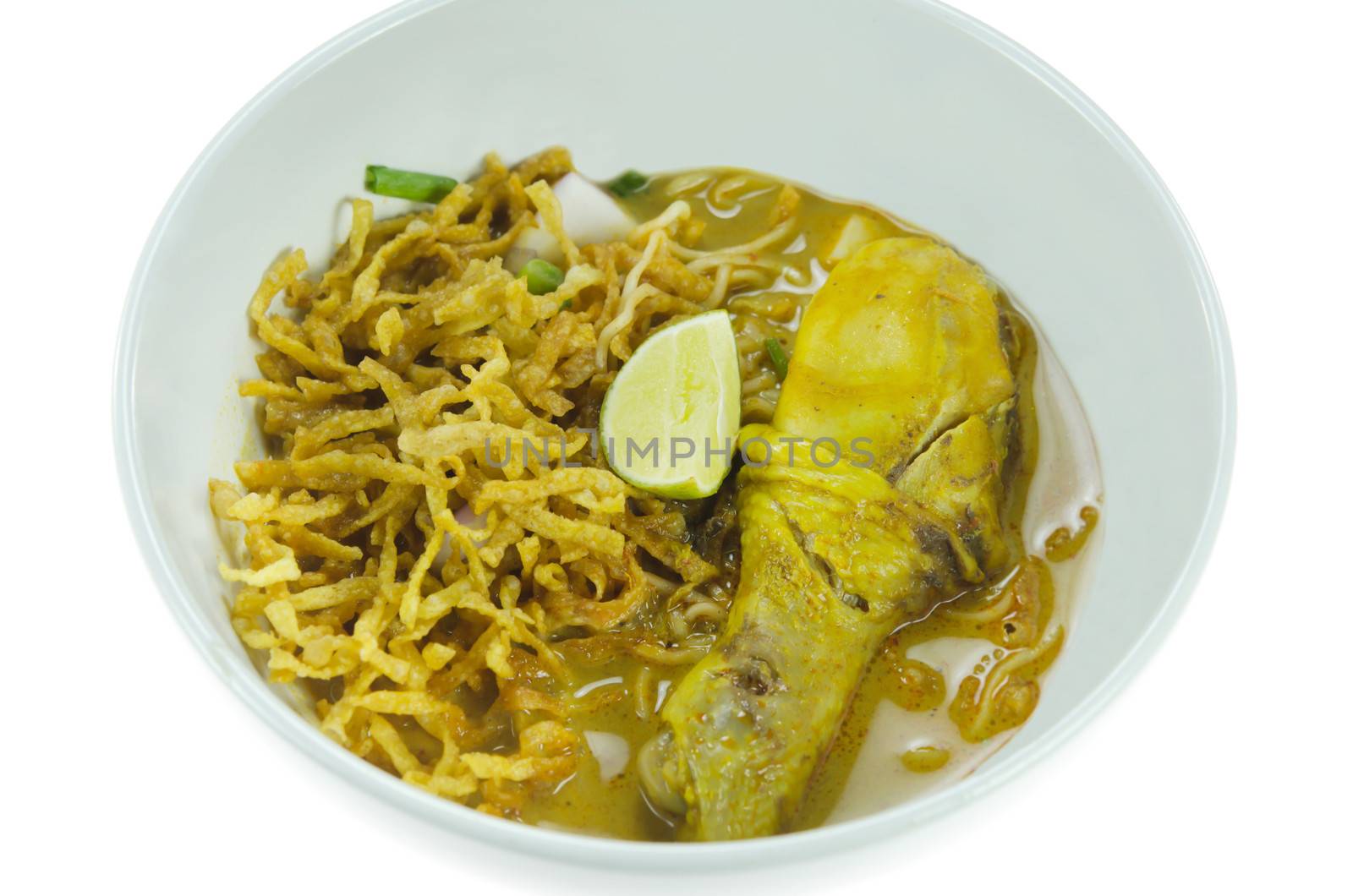 noodle dish in a yellow curry with chicken. Khao soy a famous northern Thai food.