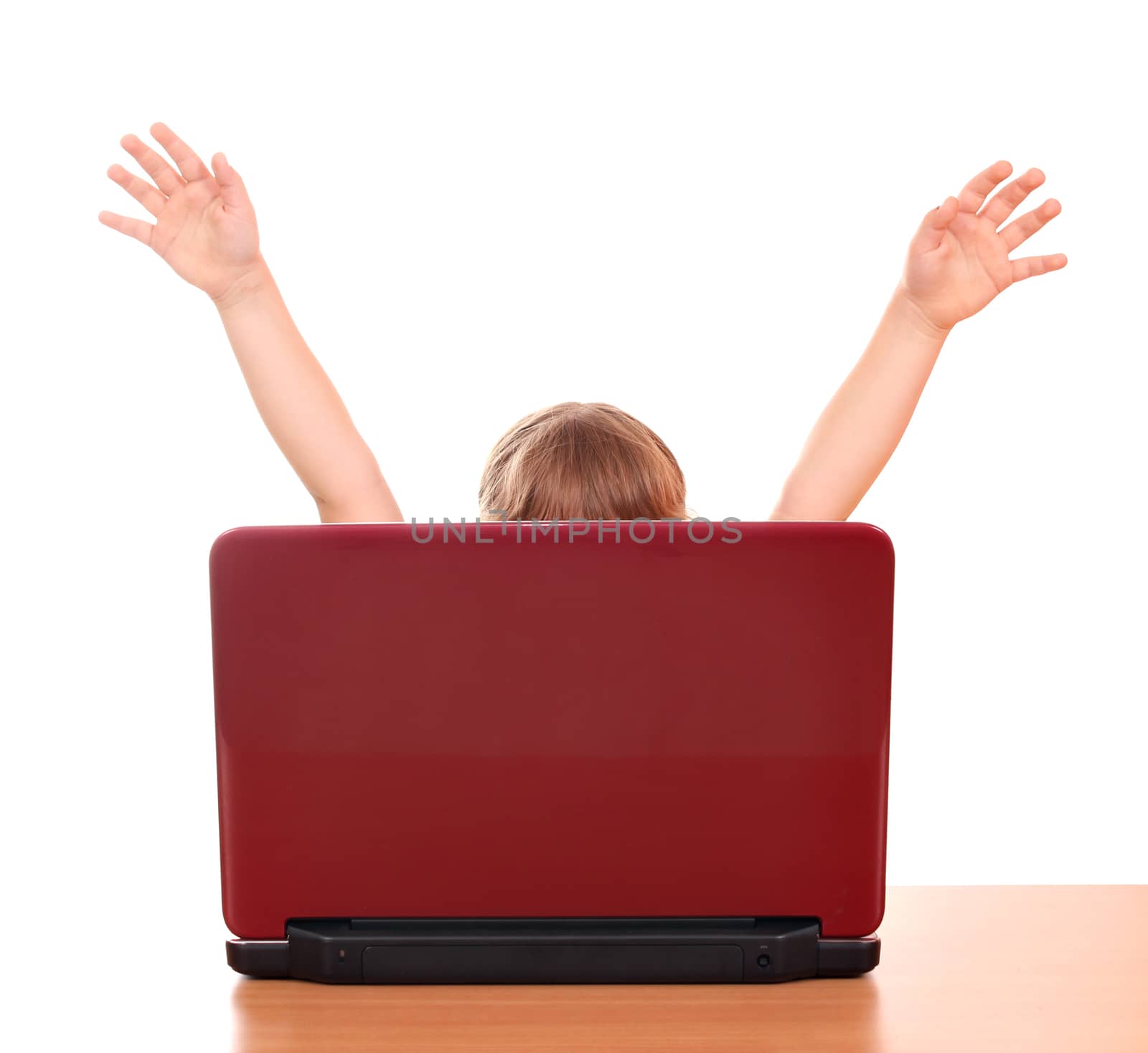 happy little girl raised his hands behind laptop by goce