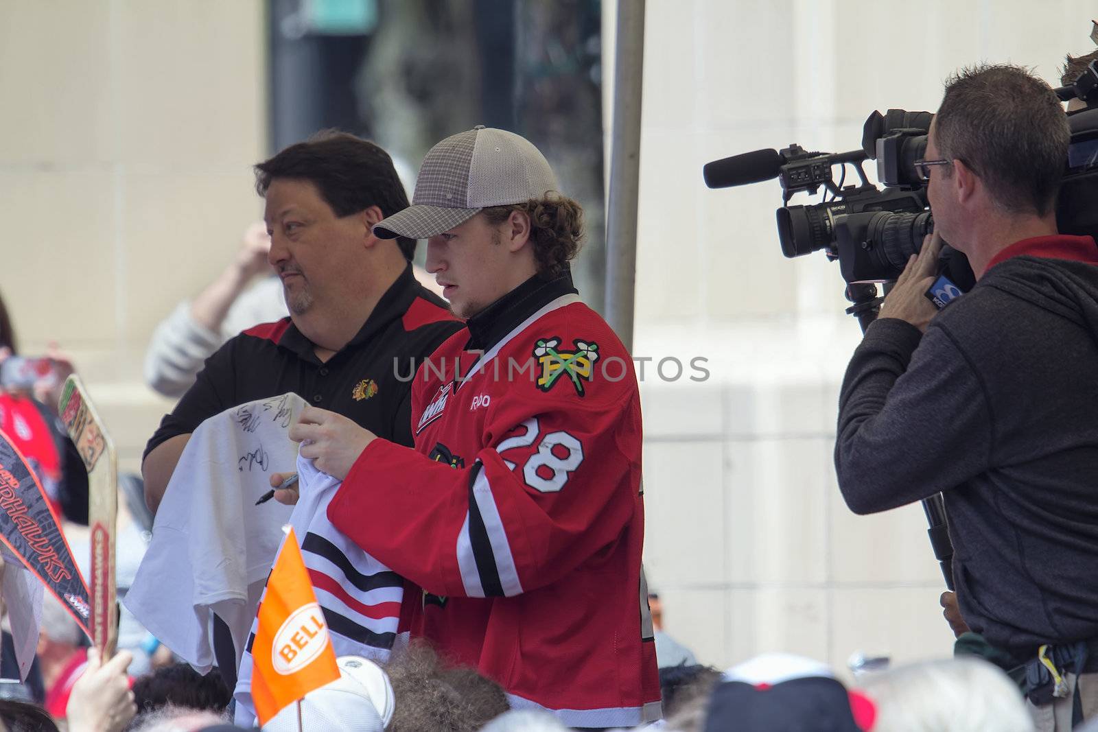 PORTLAND, OREGON - MAY 14: Portland Winterhawks Ice Hockey Team member signing autographs at Pioneer Square Rally on May 14, 2013, after winning the Western Hockey League Championship and bringing home the Ed Chynoweth Cup
