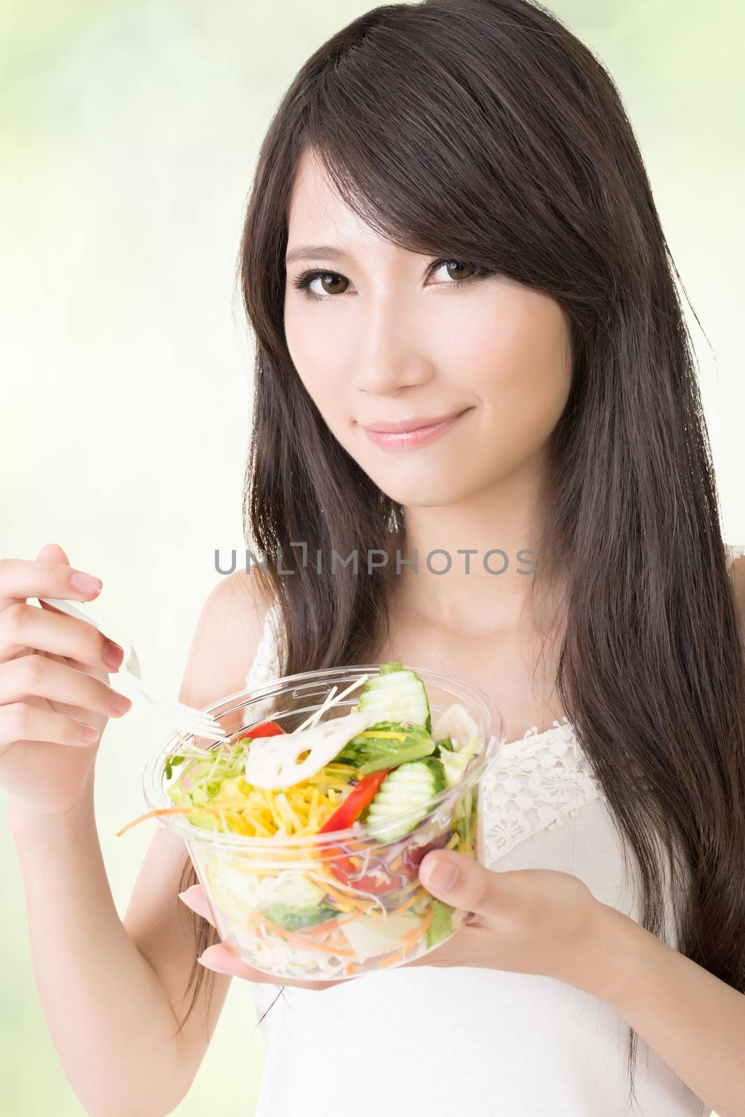 Asian beauty eat salad, closeup portrait.