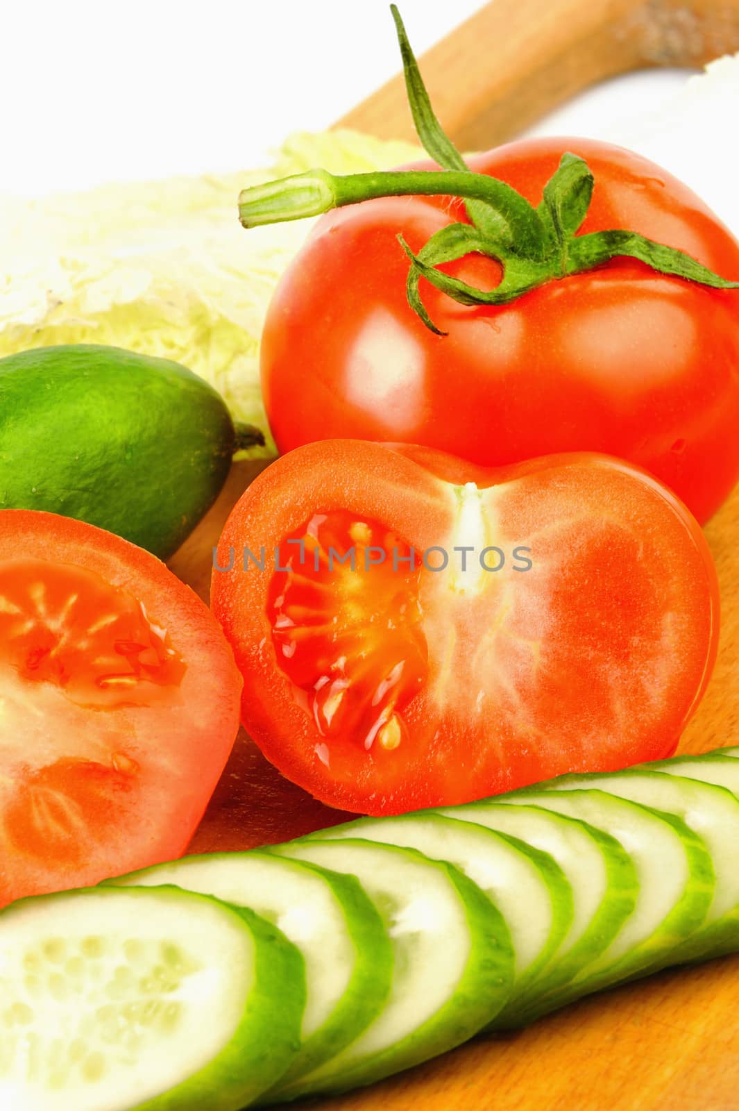 Tomatoes and cucumbers beautifully cut on the Board