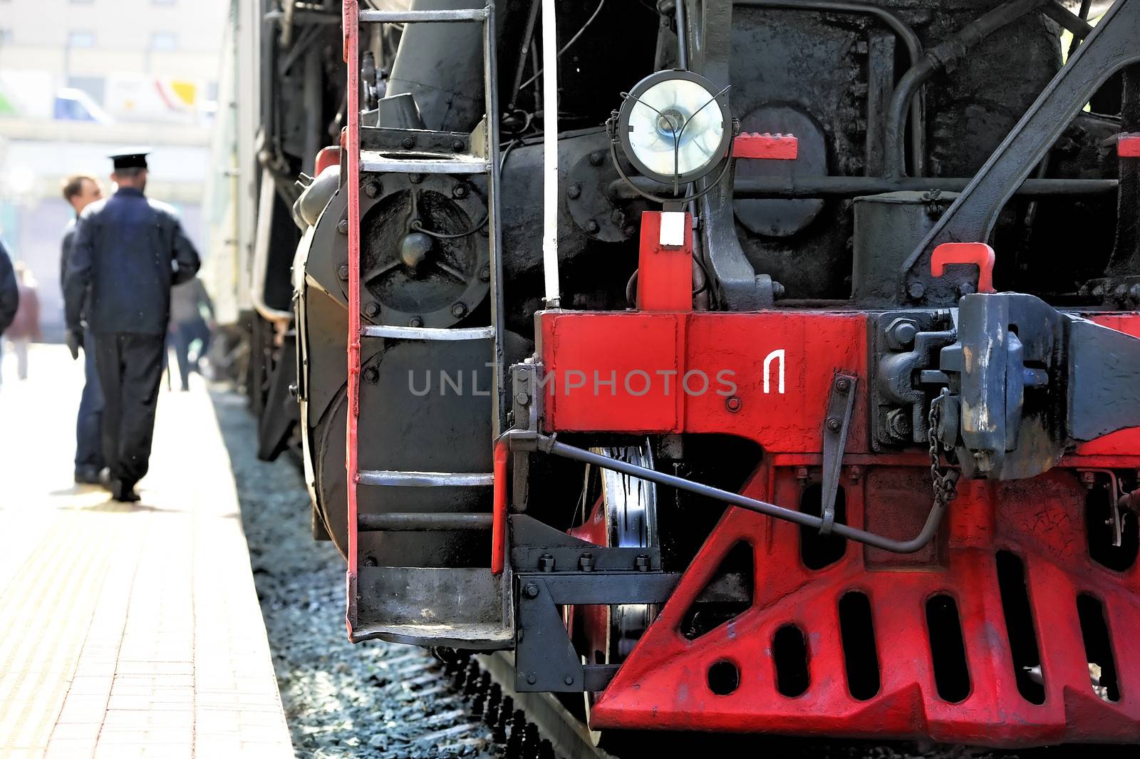 Old Russian steam locomotive on the platform by kosmsos111