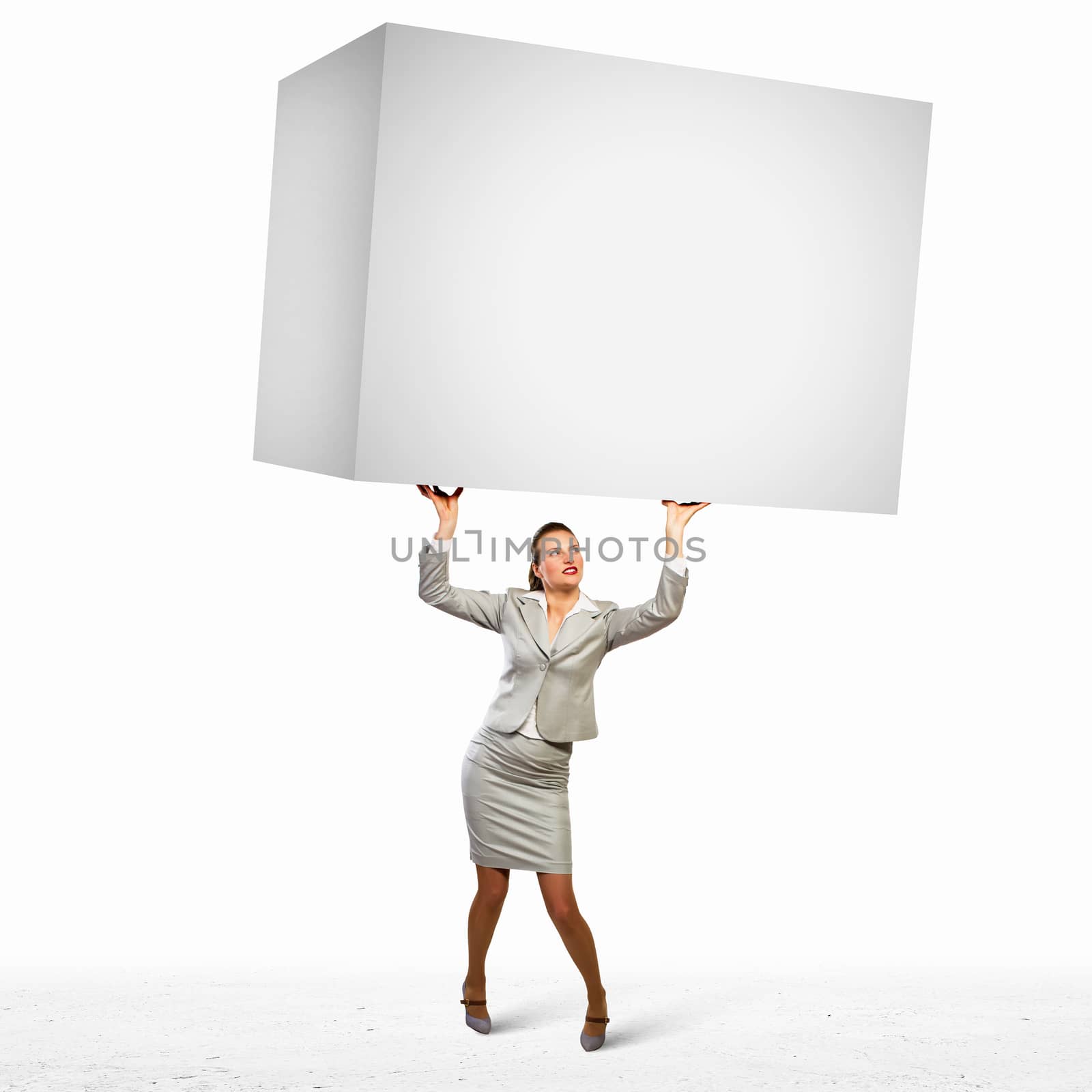 Image of business woman holding heavy white cube above head
